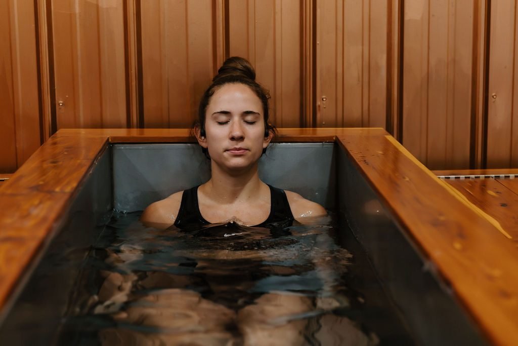 A member breathing calmly in the NUMA cold plunge, eyes closed